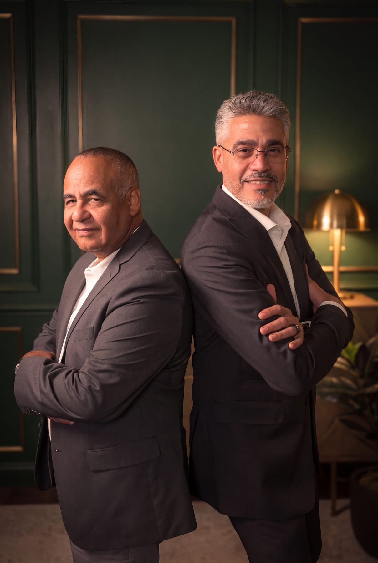 Ruben Rodriguez and Rafael Sánchez, the co-founders of RSCCA, standing back to back with their arms folded.